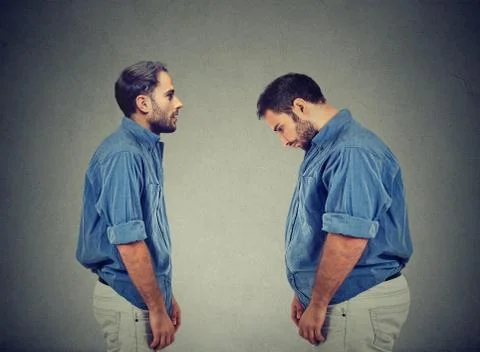 Slim guy looking at fat man himself. Diet choice right nutrition concept Foto stock
