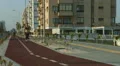 Slim lady jogging along urban road. Active lifestyle for wellness and health HD Footage