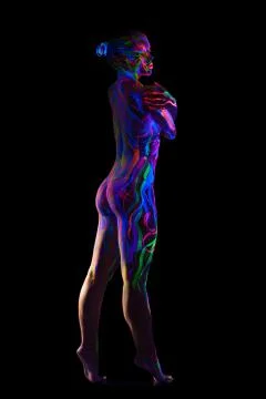 Slim nude model with glowing pattern on body Stock Photos