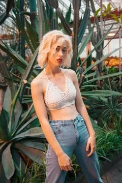 Slim seductive young model at botanical garden Stock Photos