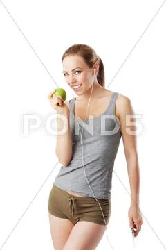 Slim woman after fitness workout going to eat an green apple Stock Photos