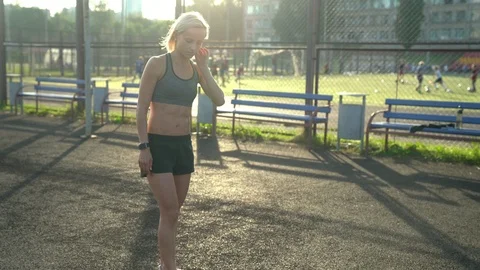 Slim woman doing push up exercise at sports ground Stock Footage 91549990
