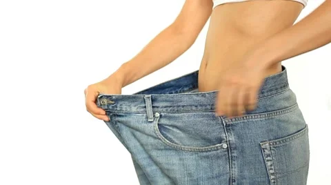 Slim woman in too big jeans, isolated on white HD Stock Footage