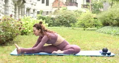 Slim woman meditating on yoga mat by yel, Stock Video