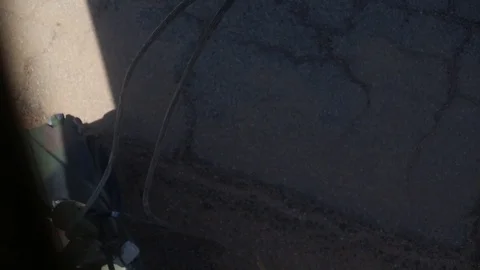 Sling load hoist being detached from helicopter Video stock 106561390