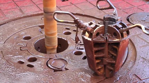 Slip on the rotary table while drilling oil well and pipe being rotated Stock Footage 40105535