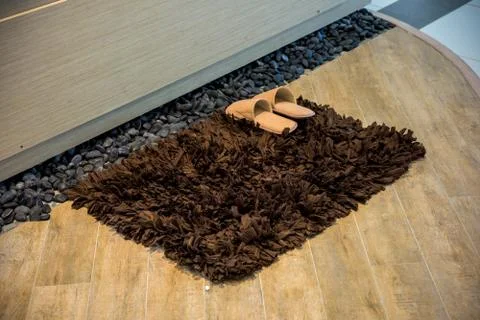 Slipper on carpet Stock Photos