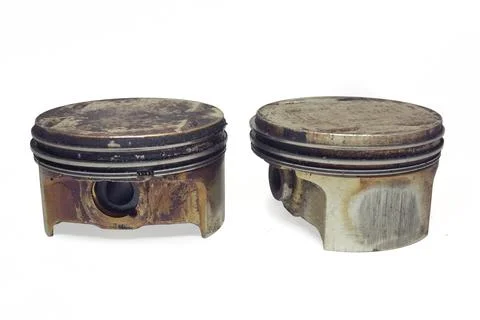 Slipper pistons pair of car engine. showing skirt side in burnt oil and hol.. Stock Photos
