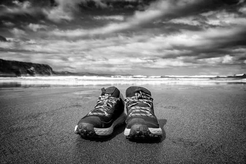 Slippers alone on the beach Stock Photos
