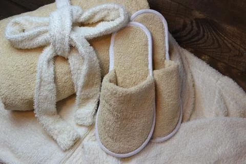 Slippers and a towel. Stock Photos