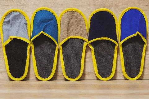 Slippers of different colors Stock Photos