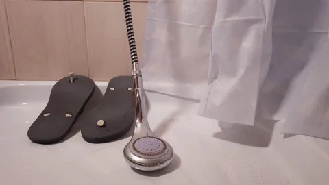 Slippers drying in a shower tray. Concept of hygiene Stock Footage 227596620