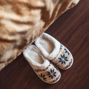 Slippers on floor Stock Photos