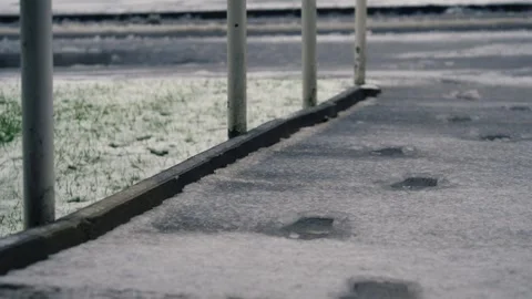 Slippery path in snow storm winter weather Stock Footage 293494251