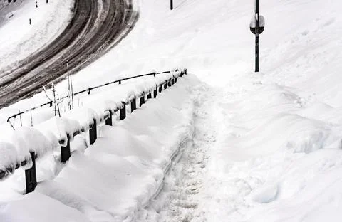 Slippery pedestrian path after snowfall Stock-Fotos