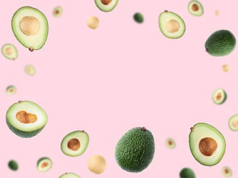 Slised avocado pattern on bright pink background. Stock Photos