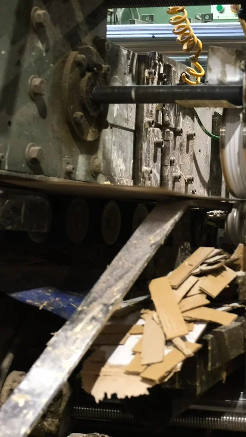 Slitting machine carves cardboard boxes from sheets of cardboard. close up,.. Video stock 306143651