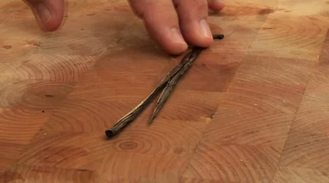 Slitting open a vanilla pod and scraping out the seeds Stock Footage 8572441