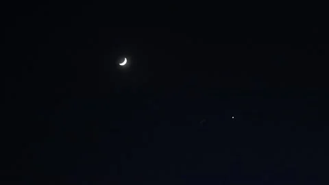Sliver of the Moon and Jupiter Video stock 343323001