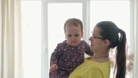 Slo-mo Authentic close up young neo caucasian mom play with infant child baby Stock Footage 150126725