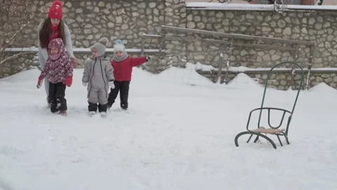 Slo-mo authentic cute happy young woman mom in red hat with children joyfully Stock Footage 153555637