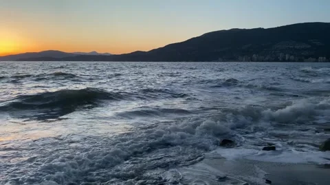 Slo-Mo of Blue Ocean Waves in the Orange Sunset Video stock 309486433