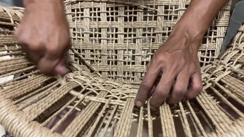 Slo Mo Cinematic Close-Up: Skilled Artisan Weaving Synthetic Rattan Chair Stock Footage 338229190
