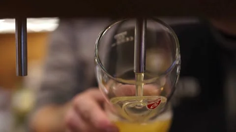 SLO MO Close up shot of Bartender pouring beer into a glass Super Slow Moti.. Stock Footage 265766374