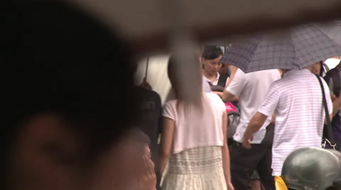 Slo-mo crowded sidewalk, many umbrellas Stock Footage 38170001