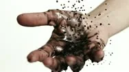 Slo Mo Cu Reverse Motion Of Black Liquid Falling On Mans Hand Against White Stock Footage