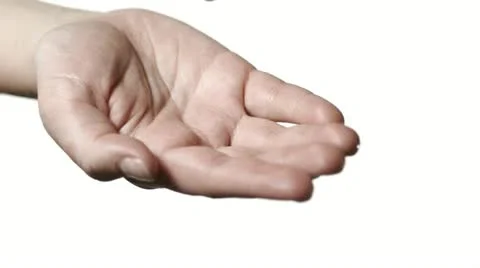 SLO MO CU Studio shot of water falling on hand against white background Video stock 11292649