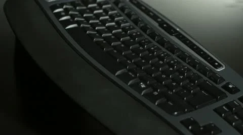 SLO MO CU Studio shot of rolling pin falling on computer keyboard Stock Footage 11292826