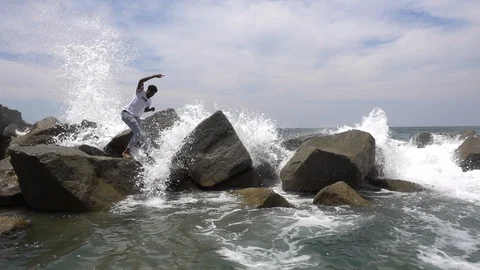 Slo mo guy gets swamped by wave Stock Footage 96007338