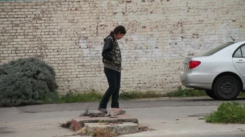 Slo-mo, kid in front of brick wall Stock Footage 155491642