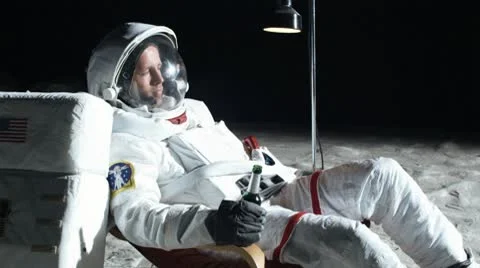 SLO MO, MS, Lockdown of an astronaut on the moon sitting in an easy chair, Stock Footage 10700574