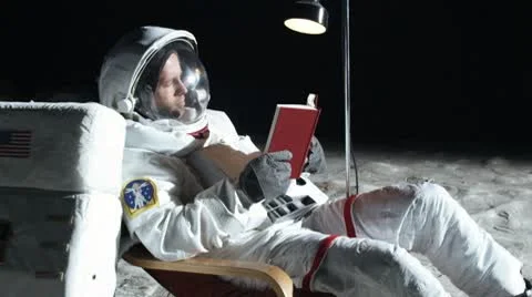 SLO MO, MS, Lockdown, astronaut on the moon sitting in a reclining chair, Stock Footage 10700759