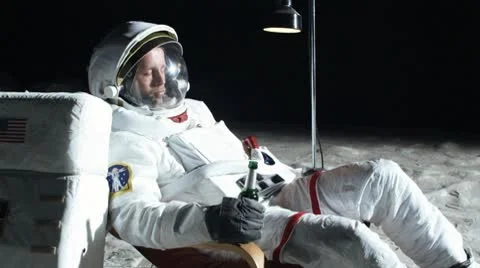 SLO MO, MS, Lockdown, astronaut on the moon sitting in a reclining chair, Stock Footage 10700809
