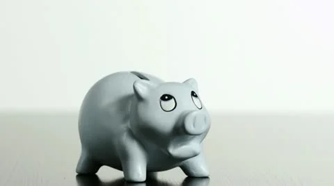 SLO MO MS Studio shot of 10 kg weight falling on piggybank Video stock 11292809