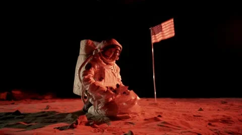 SLO MO, MS, ZI of an astronaut on Mars collecting a soil sample Stock Footage 10700505