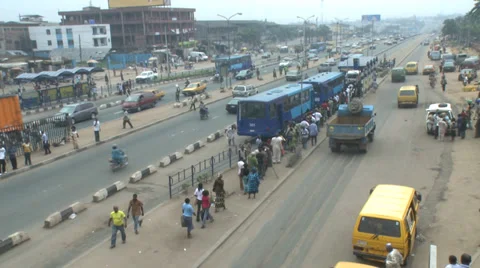 Slo-mo passengers, buses, traffic Stock Footage
