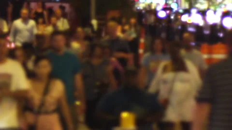 Slo-Mo Pedestrian Crowd Walking in City at night - blurred Vídeo Stock 29644228