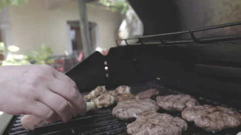 SLO MO Person putting bread on the grill Stock Footage 246698354