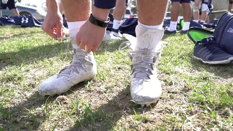 Slo Mo shot of Lacing up cleats 動画素材 77369899