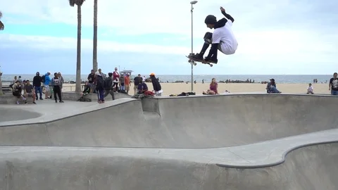 Slo mo skater doing a high jump Stock Footage 96007144