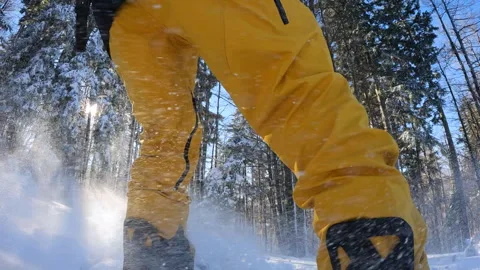 SLO MO Snowboarder having fun off piste, snow particles flying around Stock Footage 255032276