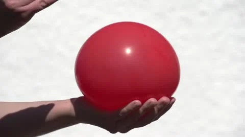 balloon popping slow motion