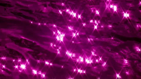 Slo-mo water sparkles. Purple. Stock Footage