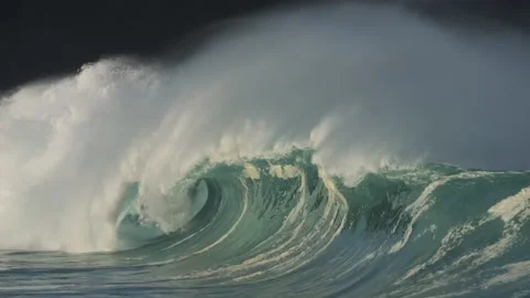 A slo-mo wave at Waimea bay during a large swell, North Shore, Oahu, Hawaii. Stock Footage 235773598