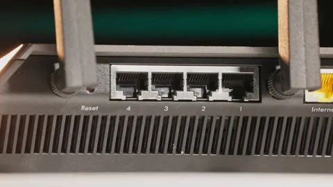 Slo mo of wi-fi routing device for local wireless and wired internet connection Stock Footage 340586127
