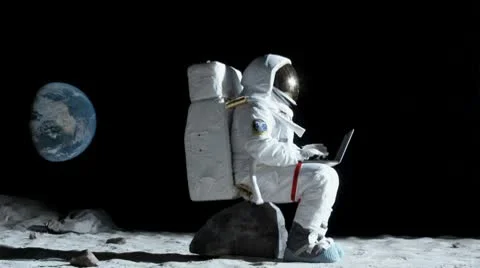 SLO MO, WS, Lockdown of an astronaut sitting on a rock on the moon using a Stock Footage 10700800